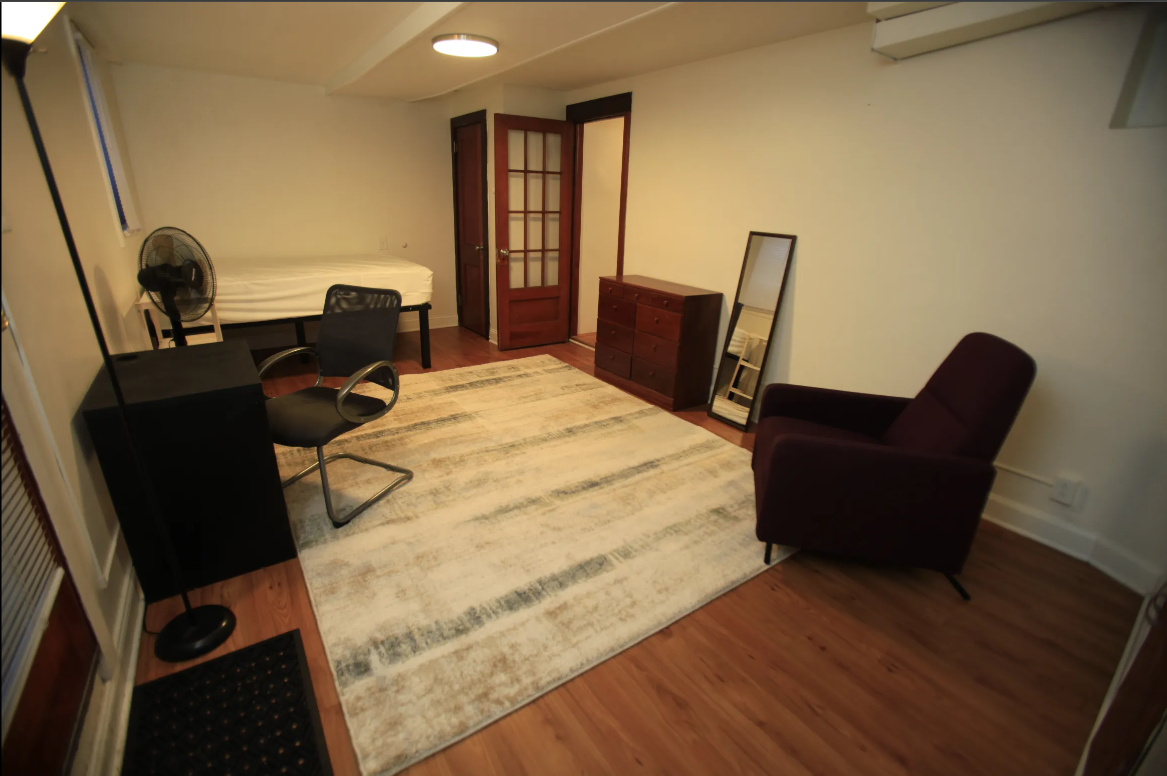 a living room with a couch and a bed